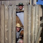 the boys playing with the fence